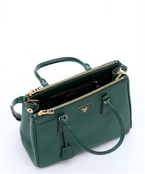 dark green prada bag.